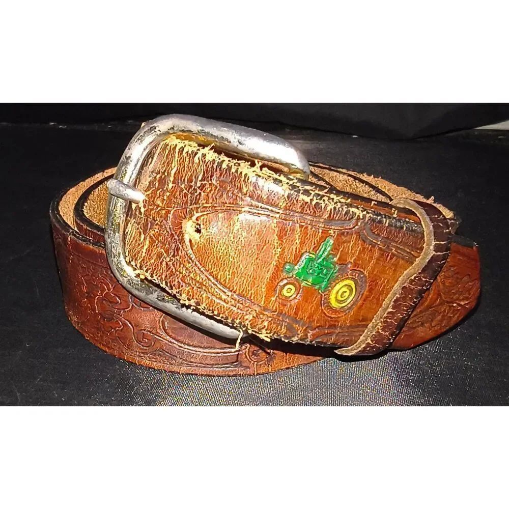 Tooled leather belt with a western vintage style, elaborate scroll design painte